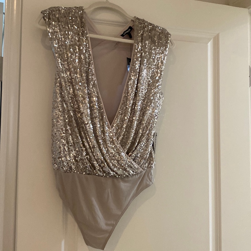 Gorgeous sequin bodysuit New with tags. Never worn. Smoke free and pet free home